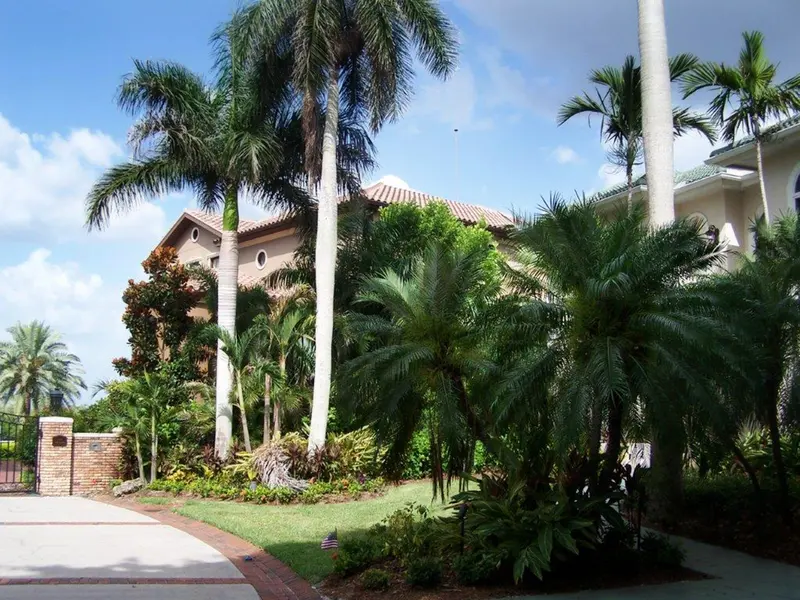 Preventor air terminal on its mast above a two-storey home, seen from the driveway